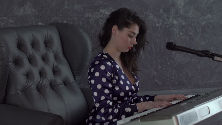 Woman Playing the Piano. | Shutterstock HD Video #1021423636