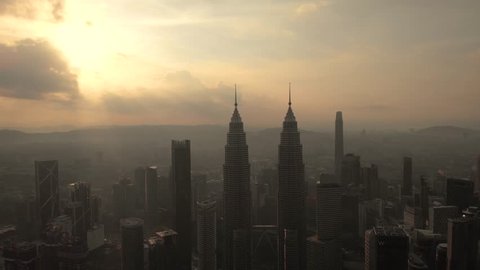 kuala lumpur, malaysia - 25 december 2018. dramatic kuala lumpur aerial shot crossing the twin tower.