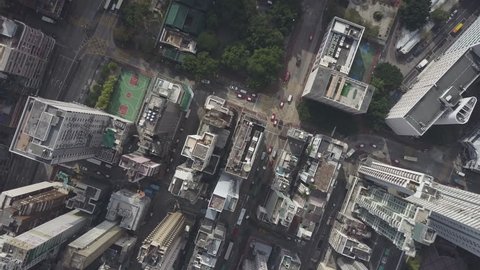 Hong Kong Circa-2017, slowly descending aerial view over buildings.