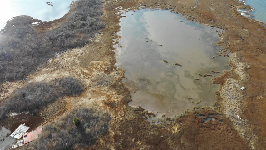 Drone flyover isolated mysterious beach community