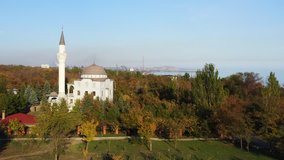 Public park in the fall. There is a mosque in the park. Mariupol Ukraine. Aerial video.