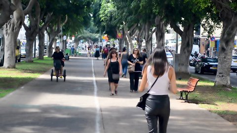 TEL AVIV, ISRAEL, October 05 2018: People at promenade on Rothschild Avenue in Tel Aviv, Israel.