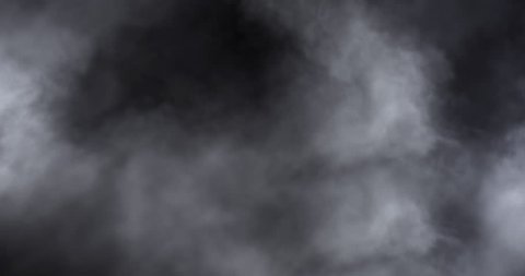 Atmospheric smoke 4K. Haze background. Abstract smoke cloud. Smoke in slow motion on black background. White smoke slowly floating through space against black background. Mist effect. Fog effect.  VFX