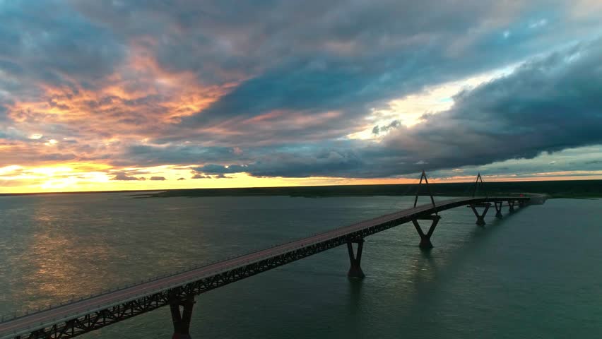 Aerial view of the sunset behind the Deh Cho Bridge, near Fort Providence Northwest Territories - Mackenzie River