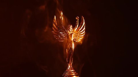 gold angel statue smoke 