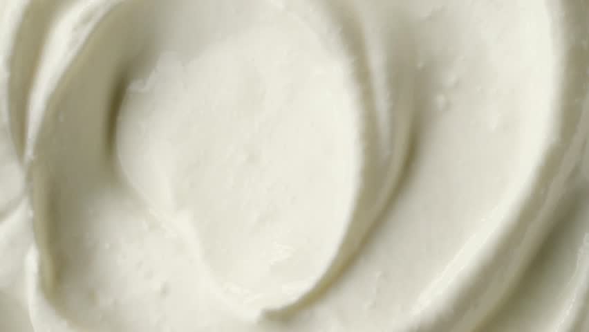 Rotating swirl of sour cream or yogurt macro | Shutterstock HD Video #1021466014