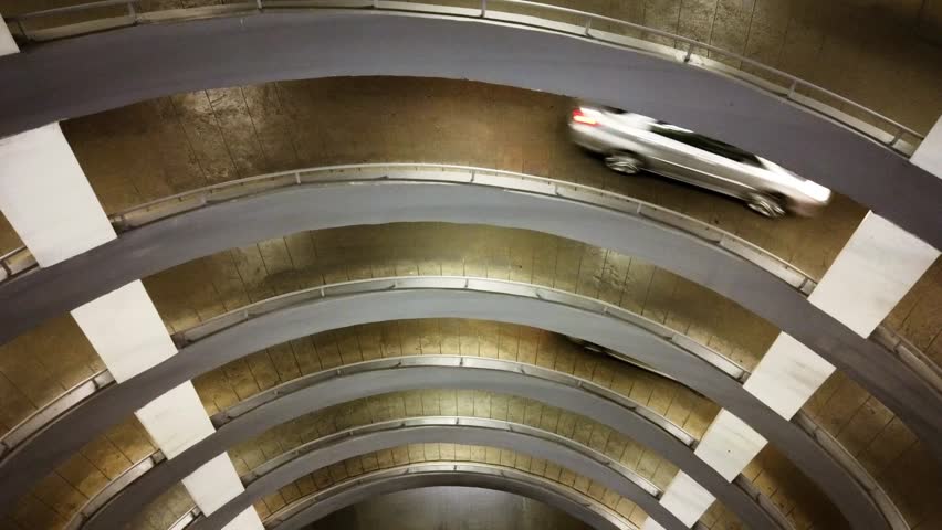 Time lapse - Circular ramp in parking garage Spiral shaped at night 