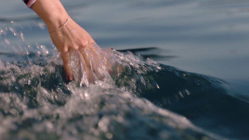 close up woman hand touching water waves splashing tourist enjoying boat ride Royalty-Free Stock Footage #1021478245