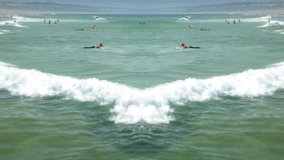Surfers In Ocean Mirror Effect Background. Overview of many surfers catching waves in the ocean. Mirror effect - Powered by Shutterstock - Get 15% off with code: PIKWIZARD15