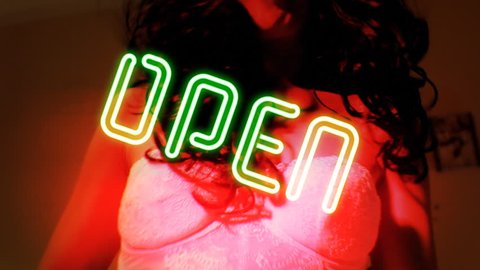 Neon text signs (Girls, Live Show, Nude, Topless, Open, Peep, Private, Sexy, Strip Club, XXX) coming closer with a rotation. Background: a lingerie girl dancing while playing with a plush toy.
