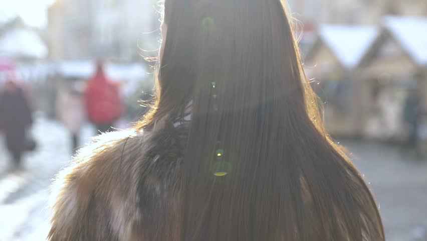 Young smiling girl are posing on the camera , are photographed in the city , laughing. HDslow motion