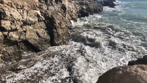 Waves crash in cove in Palos Verdes, CA