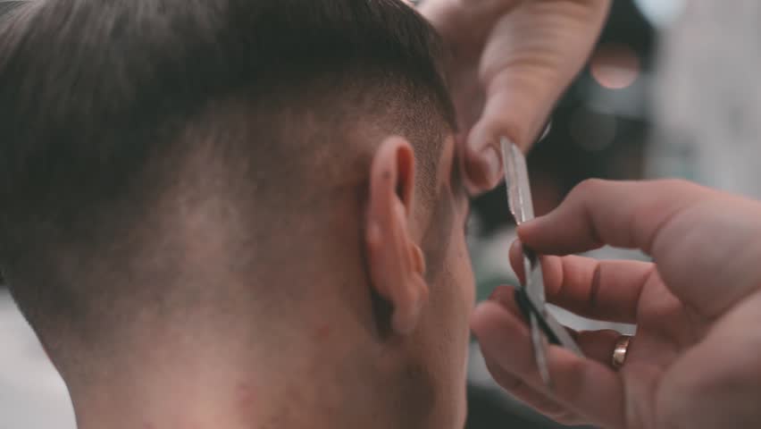 Men's haircut in barbershop. Scissor cutting. | Shutterstock HD Video #1021503859