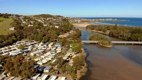 Aerial video of houses along the northen banks of Crooked River, near Gerroa inlet, NSW, Australia.