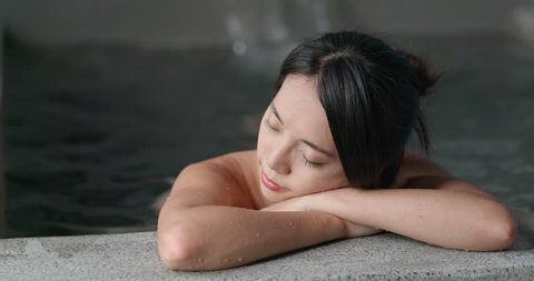 Young woman relaxing in japanese onsen