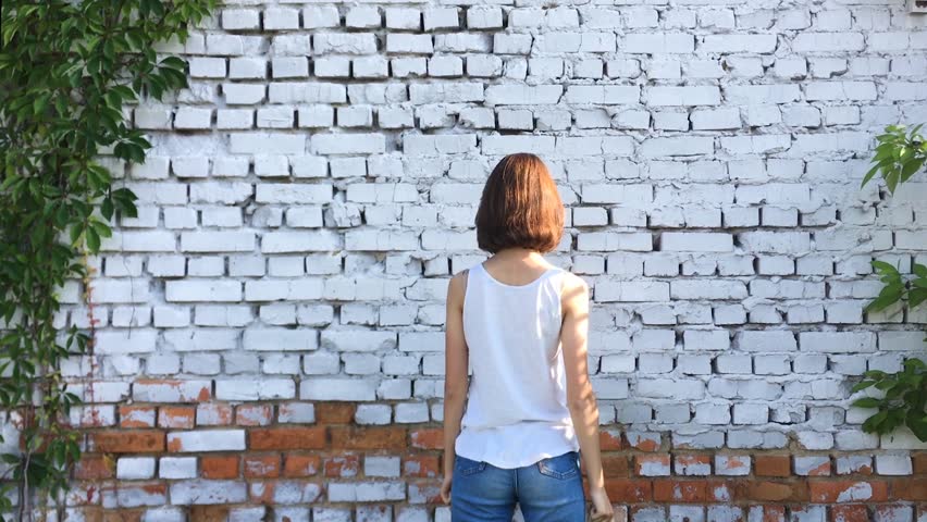Young happy hipster girl laugh and freaking out. Sunny day.
