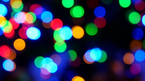 bright colored round lights on black background. Colored texture