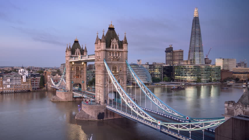 Time lapse London skyline with illuminated Tower bridge in sunrise time, UK