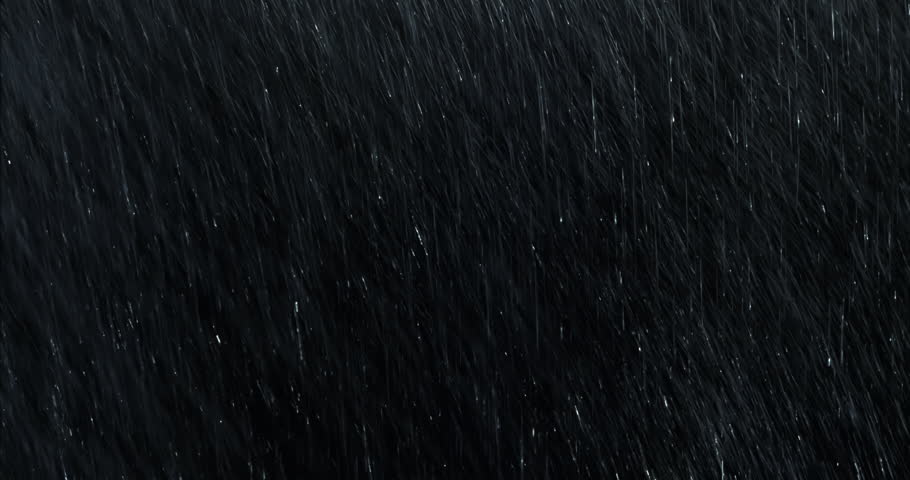 4k Heavy angled rain falling in front of the camera against black screen. Raindrops splashing. Rain closeup vfx insert. Practical seamlessly loopable footage. Heavy rainstorm hitting black surface.

