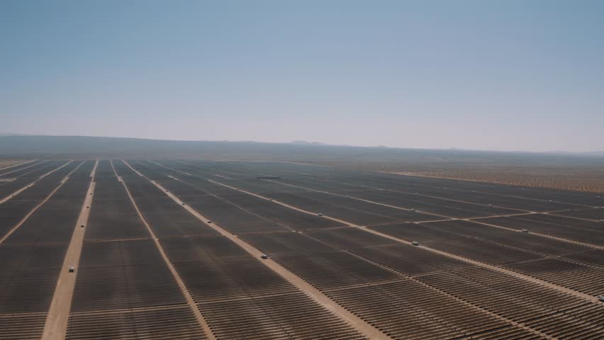Aerial view of a massive solar panel plant in the Mojave Desert, California | Shutterstock HD Video #1021538437
