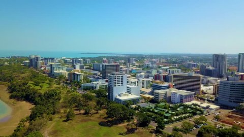 Drone footageing forwards and rotating left to right to reveal Darwin city.