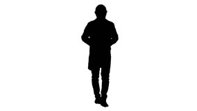 Silhouette Engineer putting on protactive glasses while walking. - Powered by Shutterstock - Get 15% off with code: PIKWIZARD15