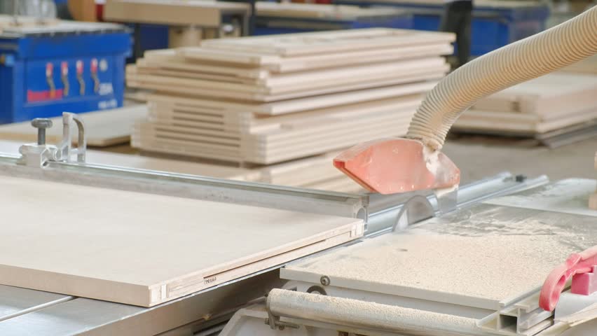 a man saws wooden door blanks on the machine, the production of village interior doors 4k