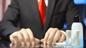 Businessman nail manicure with a file slow motion HD. Static shot of headless male person both hands in focus with long nails and manicure tools on the right side of the frame.