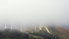 windmill turbines generators producing wind energy renewable energies in wind park, time lapse video footage