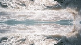 Waves Crashing Mirror Effect Ocean Background. Ocean waves top view mirror style to use as background, transition and texture. - Powered by Shutterstock - Get 15% off with code: PIKWIZARD15