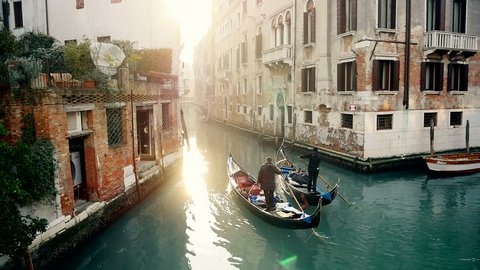 Magic drone shot of Venice with gondola in canal