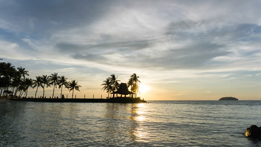 Day to night time lapse of sunset in Kota Kinabalu Tanjung Aru Beach in Sabah Malaysia