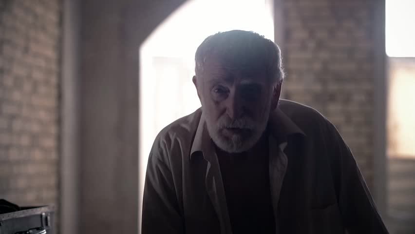 An old man of aristocratic appearance, but a bit disheveled, collects an old suitcase on the piano, a 20th century storyboard, a production video, an aristocrat in an old castle