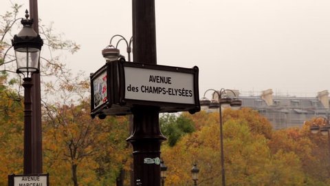 Paris, France - October 2015 : Place Charles de Gaulle sign, in Autumn, near the Arc de Triomphe and the Champs-Elysees Avenue in Paris France, on a fall day