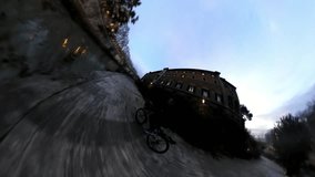 VR360 Effect Rome, A man ride a Bike along the river on Tiberina Island at Dusk