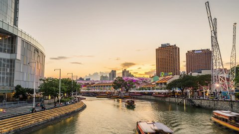 SINGAPORE - MAY 2018: 4K Day to Night Sunset Time Lapse Of Boats Streaming Past In Clarke Quay. ProRes 422 in 4k