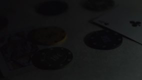 Poker chips fall on the table. Red, blue, black and green poker chips fall on the table, casino games, poker chips and cards scattered around the table. Close-up. Slow Motion. - Powered by Shutterstock - Get 15% off with code: PIKWIZARD15