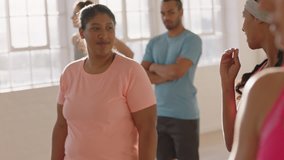 dance class overweight woman chatting to friends discussing fitness lifestyle enjoying conversation in workout studio - Powered by Shutterstock - Get 15% off with code: PIKWIZARD15