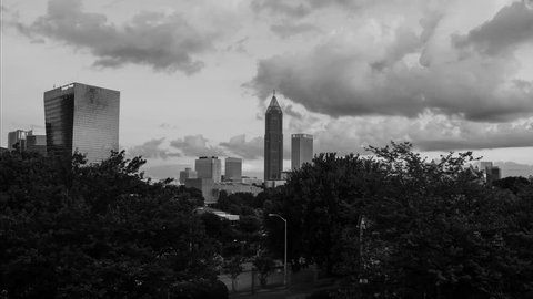 Atlanta, USA. Time-lapse of Midtown in Atlanta, USA night to day. Fast pacing clouds over the skyscrapers in the morning. Black and white