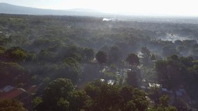 Drone video in Guatemala of village with fog at sunrise