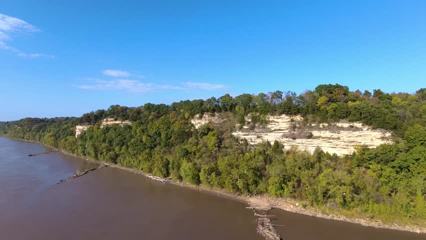 Flying over bluffs beside a river