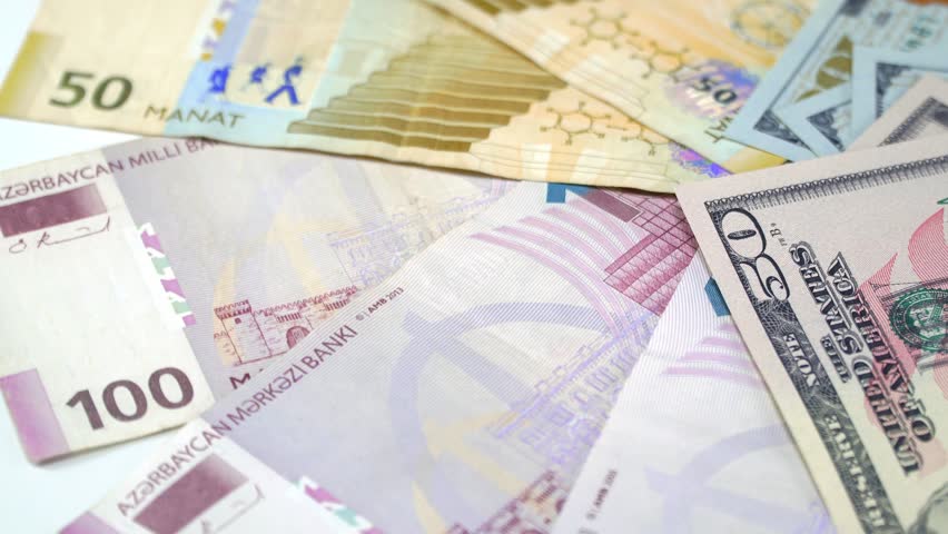 The Azerbaijani manats and dollars on the rotating table. 4K Royalty-Free Stock Footage #1021621543