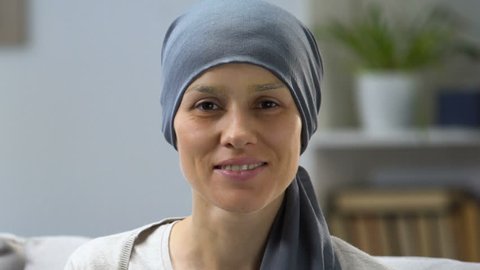 Happy cancer survivor woman smiling at camera, remission and hope for recovery
