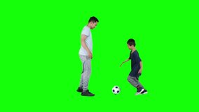 Happy little boy playing soccer ball with his father in the studio. Shot in 4k resolution - Powered by Shutterstock - Get 15% off with code: PIKWIZARD15
