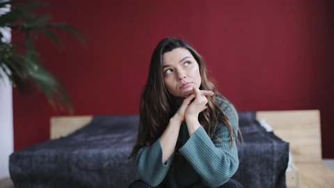 portrait of atractive brunette woman thinking about something