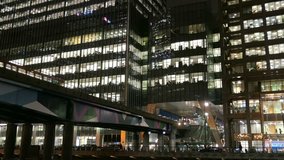 London Canary Wharf Offices Skyscrapers and Railway Trains at Night - Powered by Shutterstock - Get 15% off with code: PIKWIZARD15