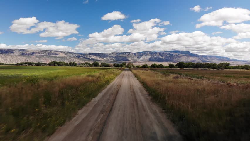 Country roads in Wyoming with the Big Horn Mountains in the background.