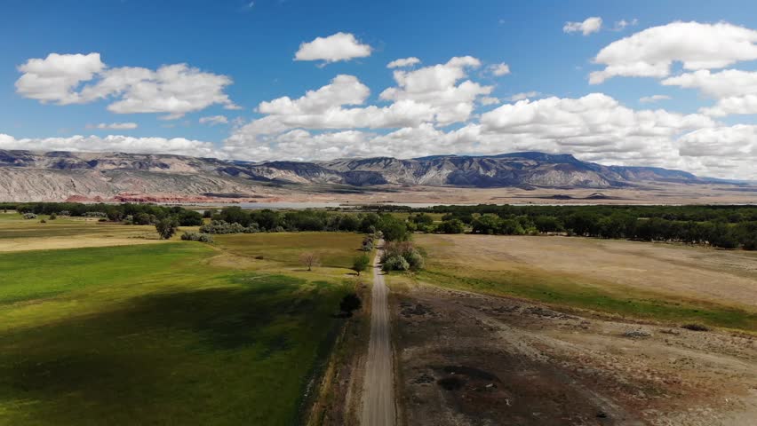 Country roads in Wyoming with the Big Horn Mountains in the background.
