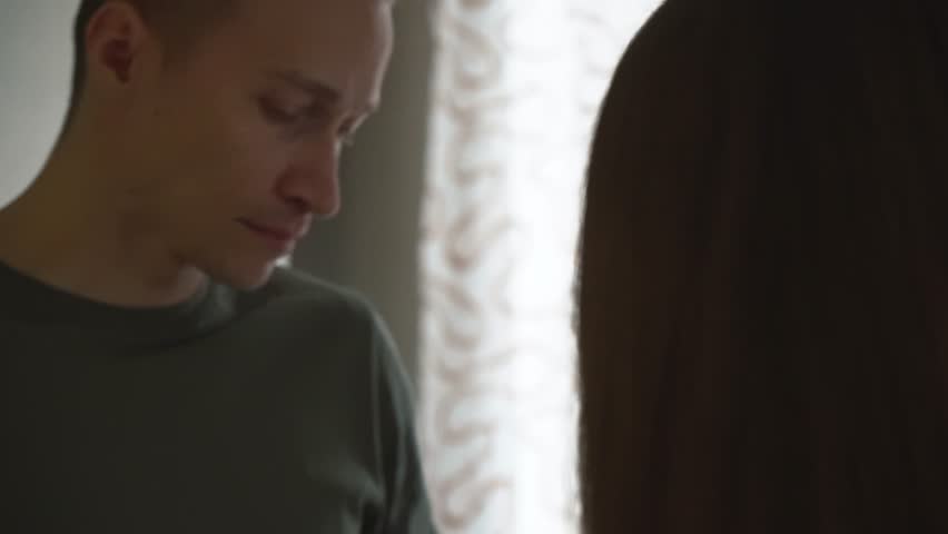 Close-up of sad man looking at his wife and going away. Relationship difficulties. | Shutterstock HD Video #1021654480