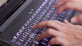 Asian man two hands typing fast on a laptop keyboard sliding shot - Powered by Shutterstock - Get 15% off with code: PIKWIZARD15